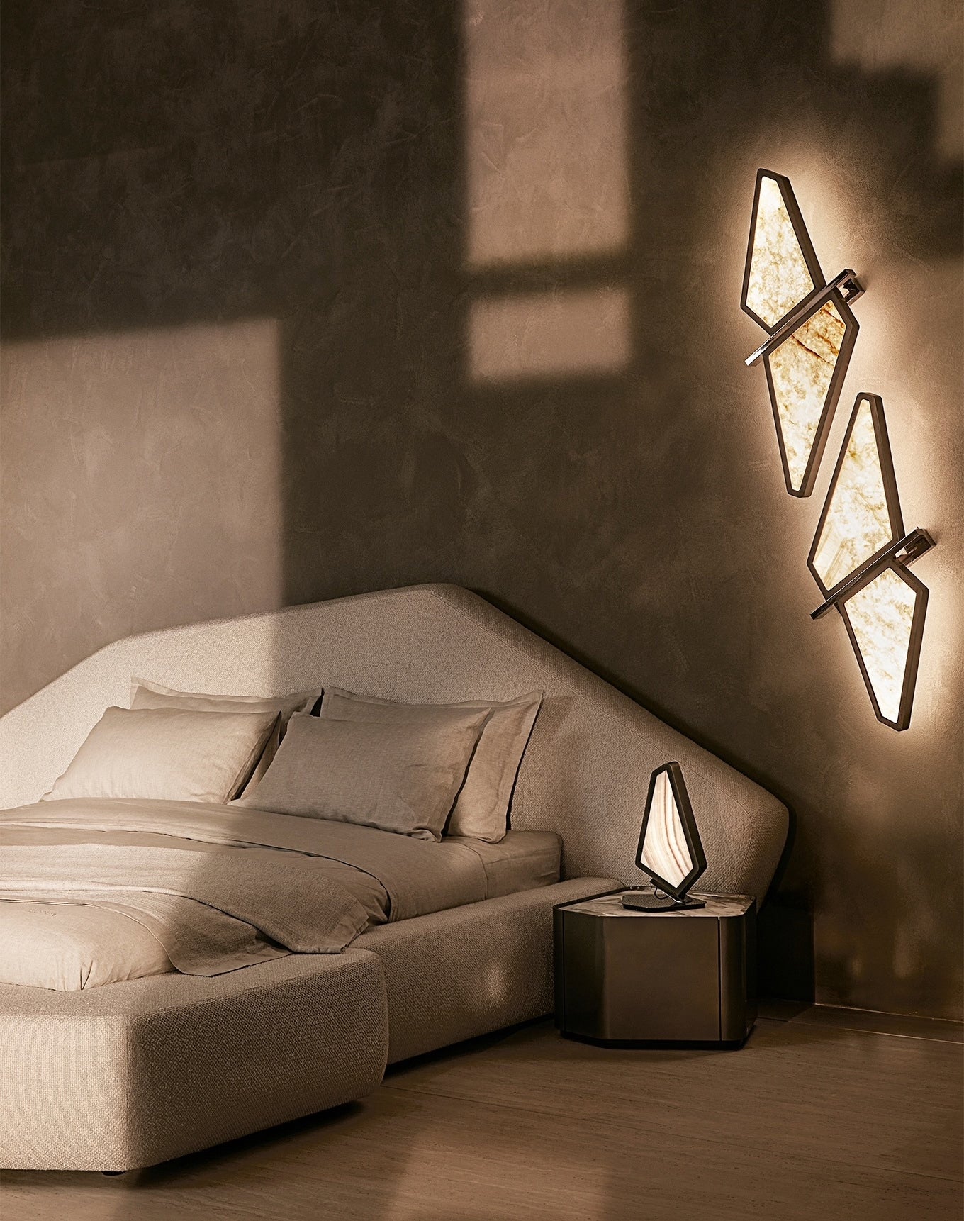 Backlit onyx wall lamp and table lamp in bronze frame in modern design 
