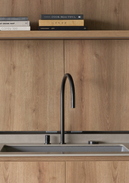 Modern kitchen with wooden cabinets, black faucet