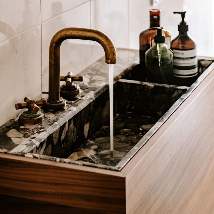 Marble sink with aged bronze faucet three hole tap