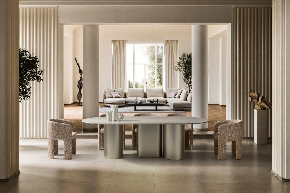 Modern living room with a round dining table and chairs.