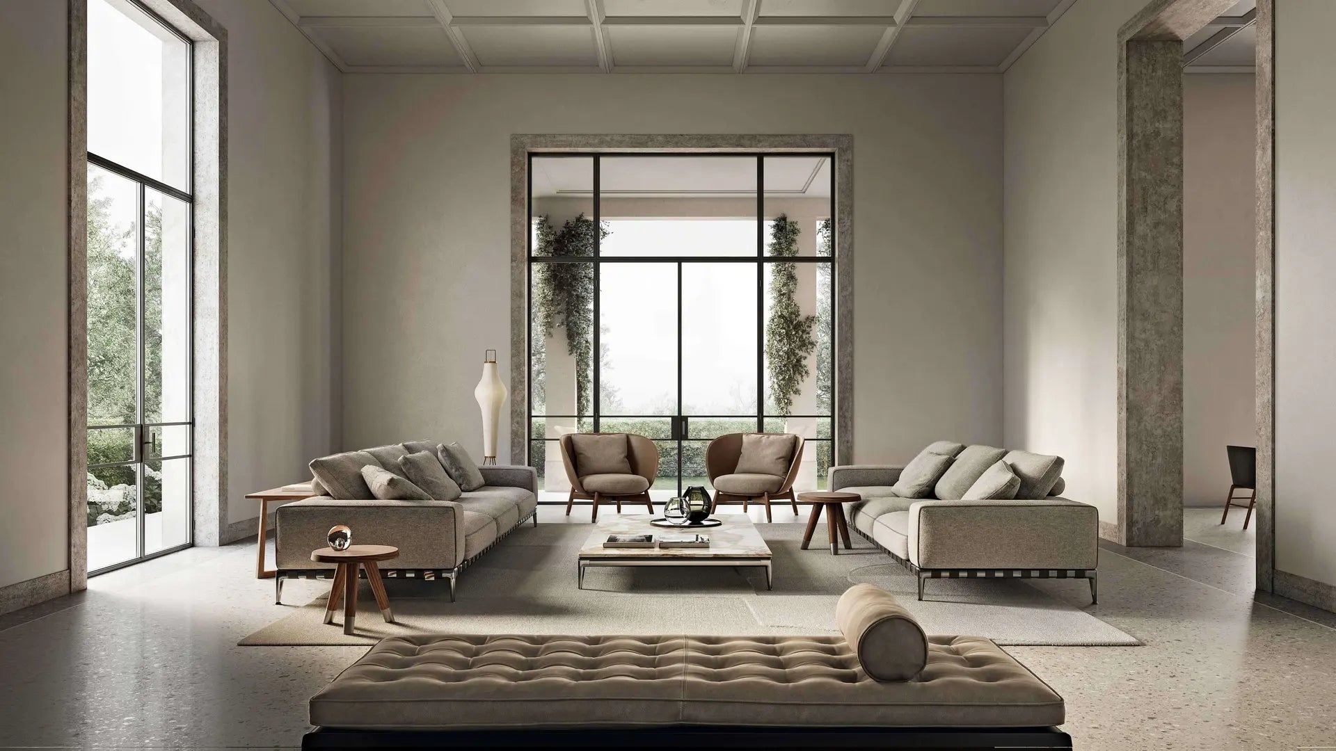 Flexform Modern living room with gray sofas, coffee table, and decorative items.