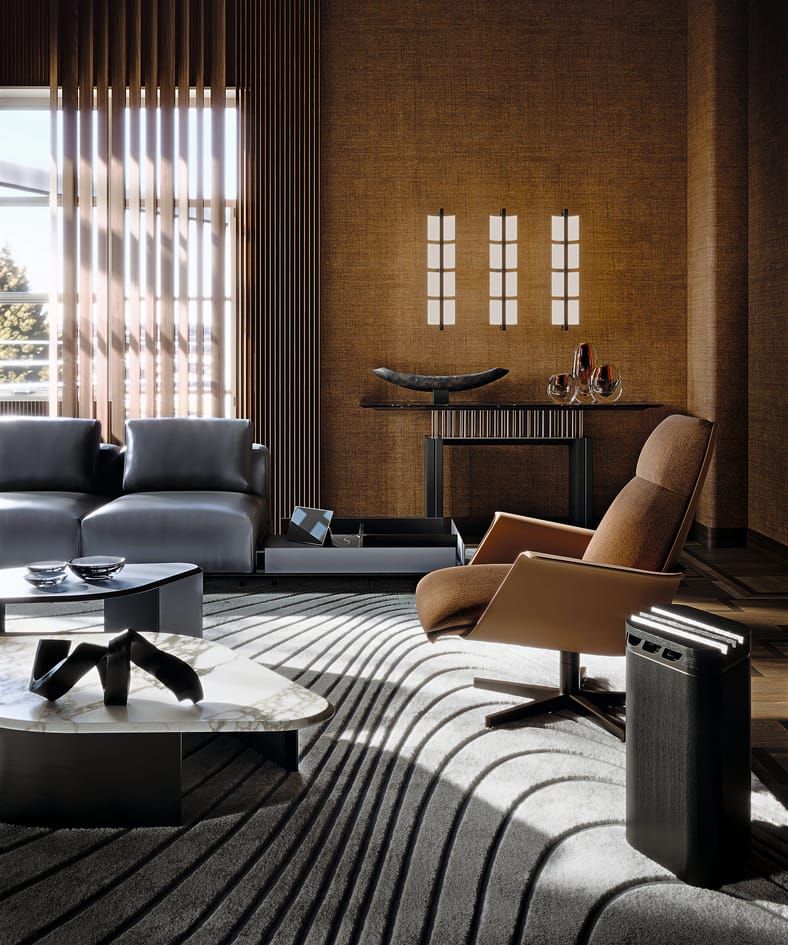 Modern living room with gray sofa, brown armchair, and coffee table.