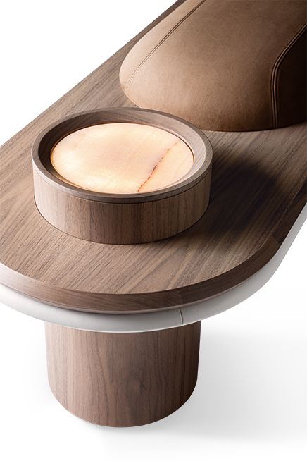 Wooden bench with a round wooden lamp on top