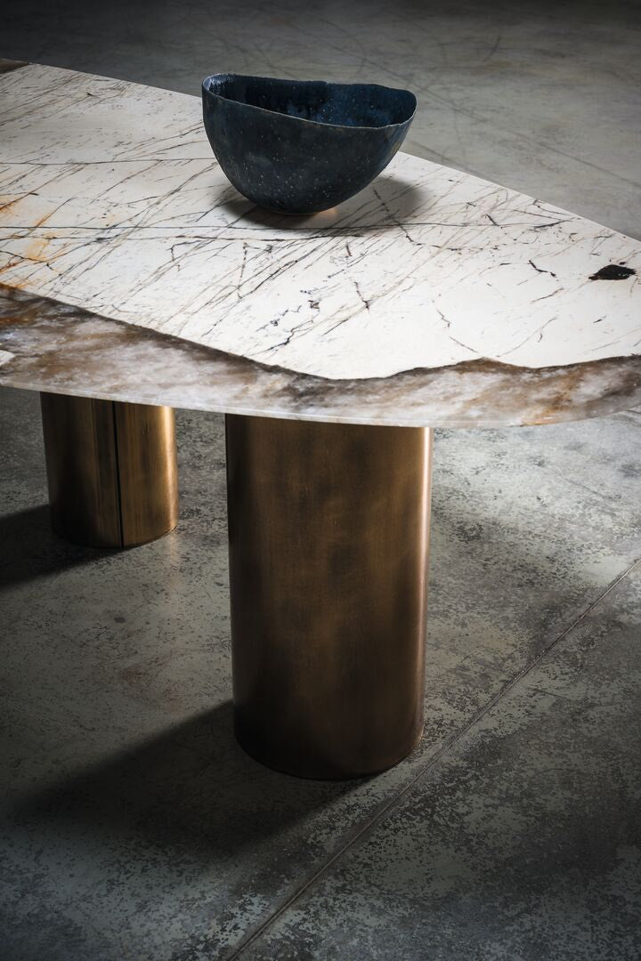 Patagonia marble quartzite dining table with bronze legs