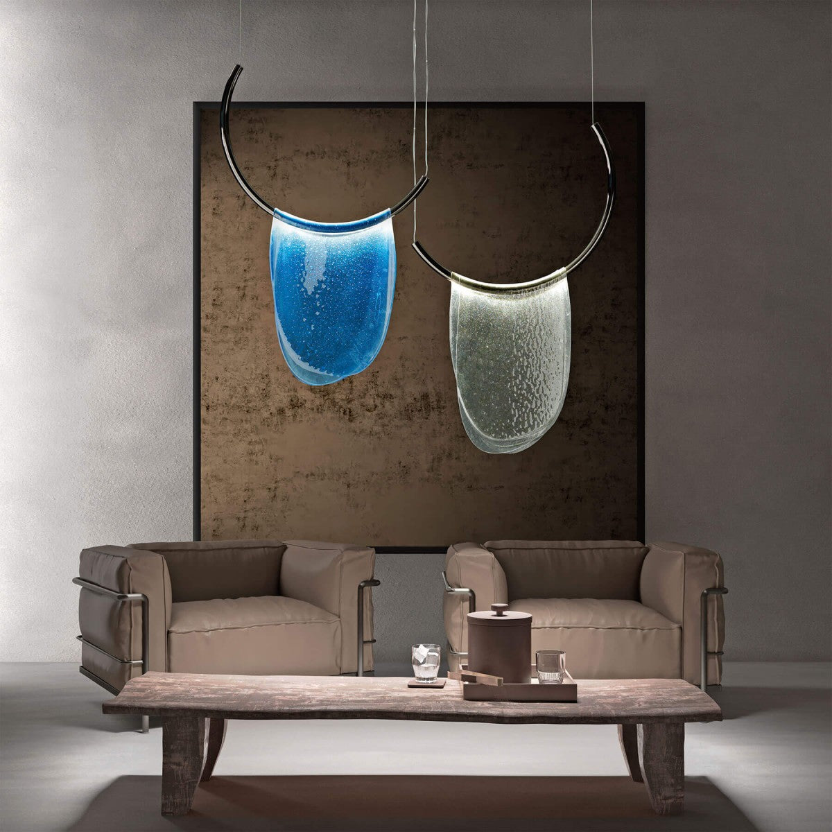 Modern living room with two hanging pendant lights, a sofa, and a coffee table.