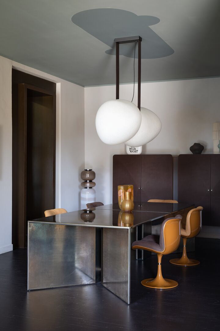 Modern stainless steel dining table with chairs and suspension lamp 