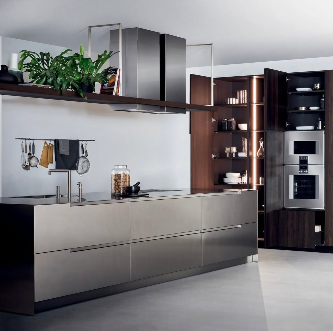 Modern stainless steel kitchen with island and hood and appliances 