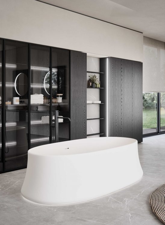 Modern interior white matt freestanding bath with dark wood cabinets with led lighting