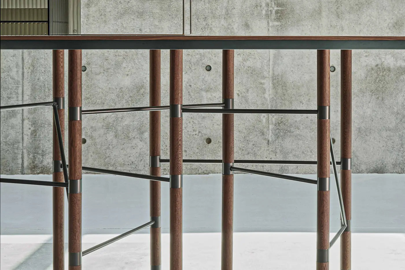 Modern wooden and stainless steel dining table with details 