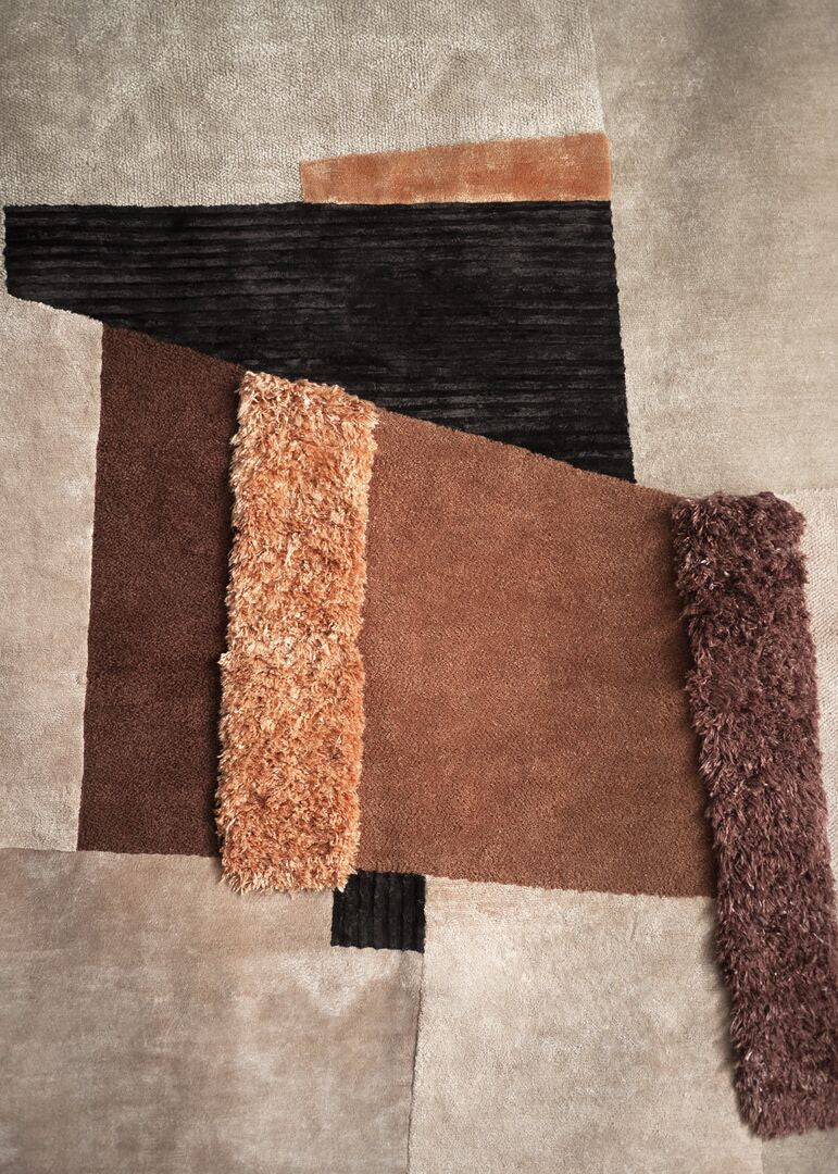 Multicolored textured rug with geometric pattern on a neutral background