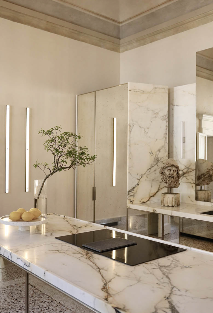 Modern kitchen with marble countertop and stainless steel appliances